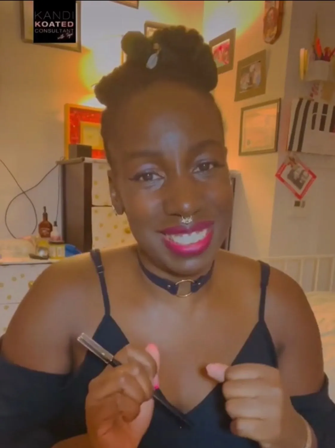 Taja, a sensual wellness educator and passion party planner, smiling in her beauty studio